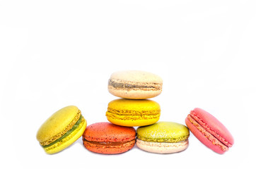 Colorful macarons on white background