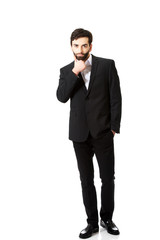 Obraz premium Young handsome businessman standing.