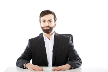 Businessman sitting at the desk.