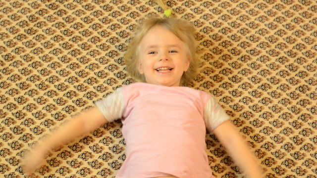 Happy Child Lying on a Carpet, Crazy Emotions