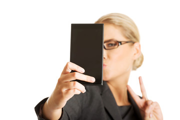 Businesswoman taking selfie