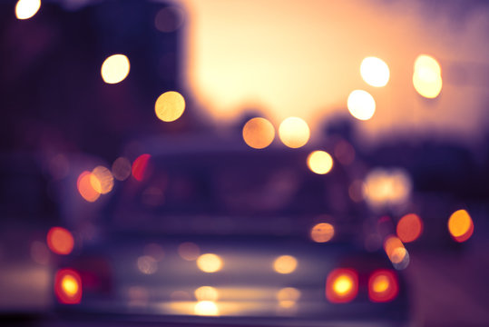beautiful background of bokeh lights at night on road with car