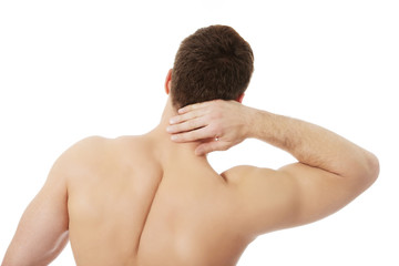 Athletic man feeling pain in his neck.