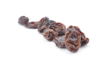 Dried raisins on a white background