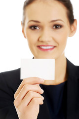 Businessswoman holding empty card.