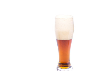full glass of cold beer with foam