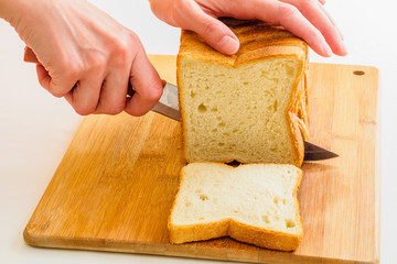 Cutting bread by knife