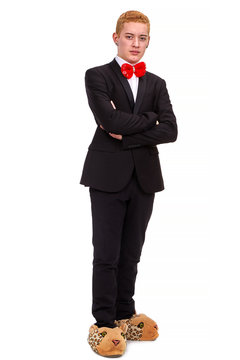 Serious businessman with a funny bowtie and animal slippers in a