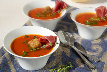 Tomato cream soup with bresaola and thyme