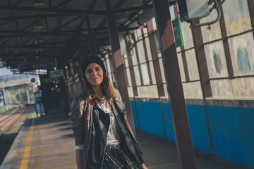 Pretty girl posing in a metro station