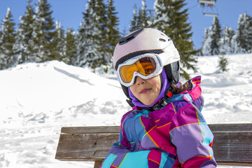 Girl with ski goggles and helmet