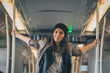 Pretty girl posing in a metro car
