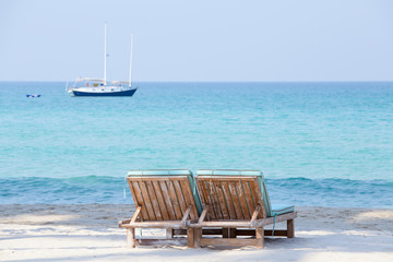 Two beach chairs and beautiful sand beach