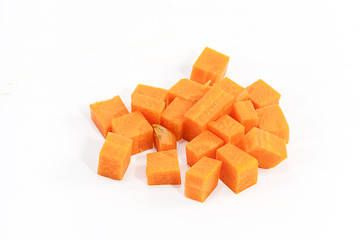 Carrot chopped into cubes isolate on white background