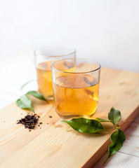 cup of green tea on wooden table