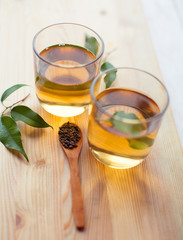 tea and tea leaves on wooden table