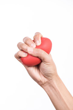 Hands of a woman squeezing a stress ball
