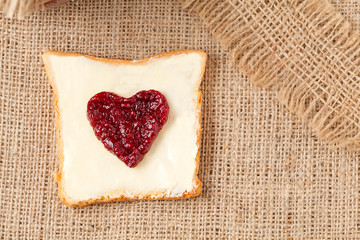Healthy wholewheat toast with heart shaped jam