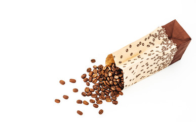 Paper bag with grain coffee on white background. coffee beans