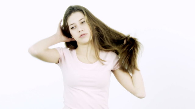 Girl with long hair annoyed by volume and split ends