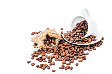 white cup with coffee beans isolated