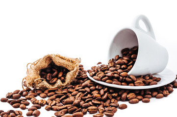 white cup with coffee beans isolated