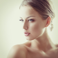 Beauty portrait of young woman with beautiful healthy face, stud