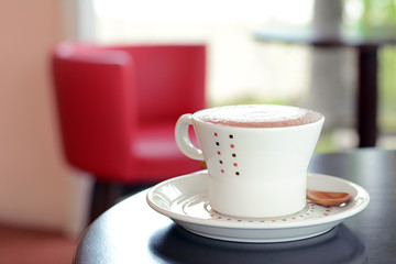 Coffee cup on the table in coffee shop