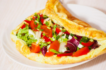 Omelet with vegetable salad
