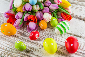Beautiful bouquet of tulips with easter eggs