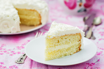 cake with vanilla cream in the form of roses