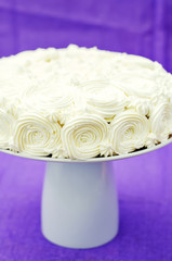 cake with vanilla cream in the form of roses