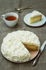 cake with vanilla cream in the form of roses