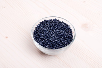 raw black beans on the board diet food