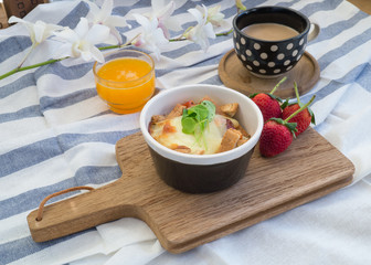 breakfast with toasts, egg, coffee and fruits