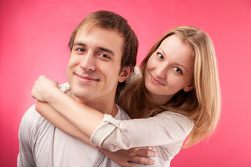 smiling couple hugging, looking in the camera