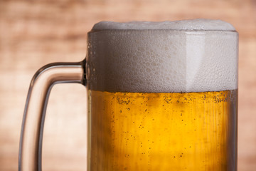 Glass beer on wood background