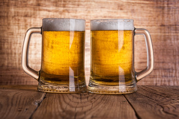 Glass beer on wood background