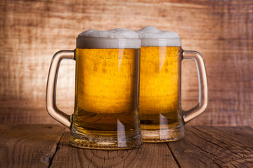 Glass beer on wood background