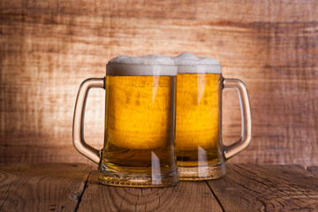 Glass beer on wood background