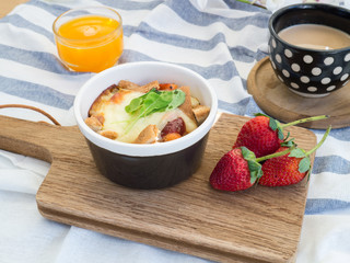 breakfast with toasts, egg, coffee and fruits