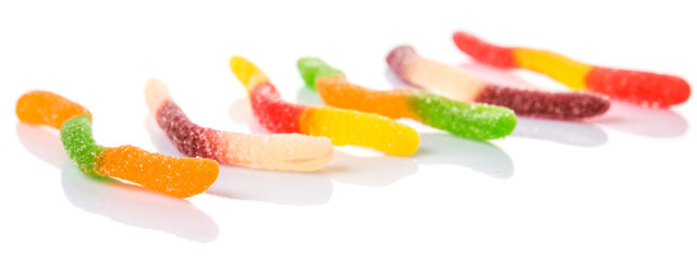 Colorful sugar jelly candy strip over white background