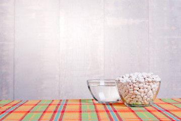 raw white beans on the board dietetic food