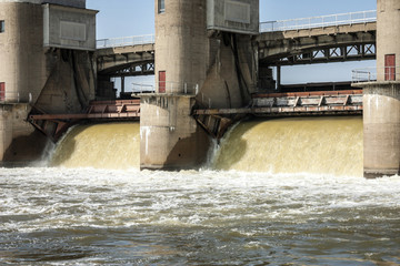 water discharge at the river dam in the spring flood