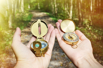 Man and woman holding compasses