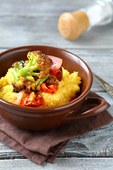 Polenta with roasted peppers,  broccoli in a bowl