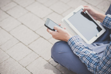 handsome hipster casual multitasking modern man using tablet