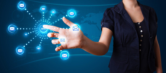 Woman pressing virtual messaging type of icons