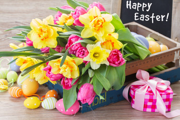 spring flowers bouquet with easter eggs