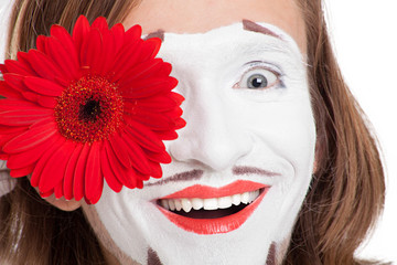 mime actor with red flower on his face